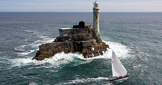 Carina yacht at the Fastnet Rock