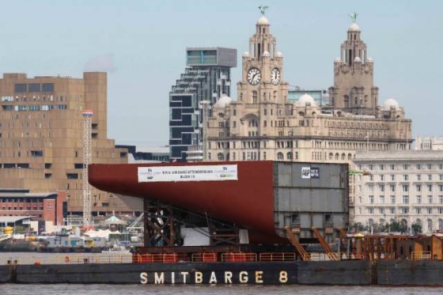 Stern Block 10 (off Liverpool Waterfront) is seen on a barge bound for Birkenhead where the £200m new British polar research vessel RRS Sir David Attenborough is under construction. Originally, through a public online competition to name the vessel, the winner was 'RRS Boaty McBoatface', however this was rejected by officials.