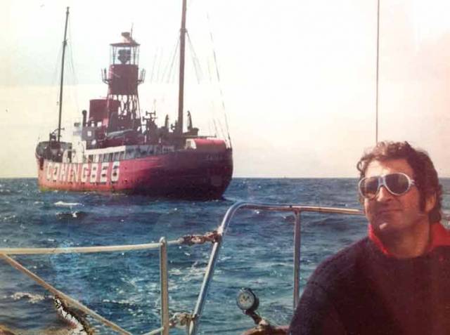 Man of the sea. Hugh Kennedy at the helm of his Clare Lallow-built classic Tosca IV, putting the Coningbeg Lightvessel astern during the annual summer pilgrimage to Baltimore in West Cork