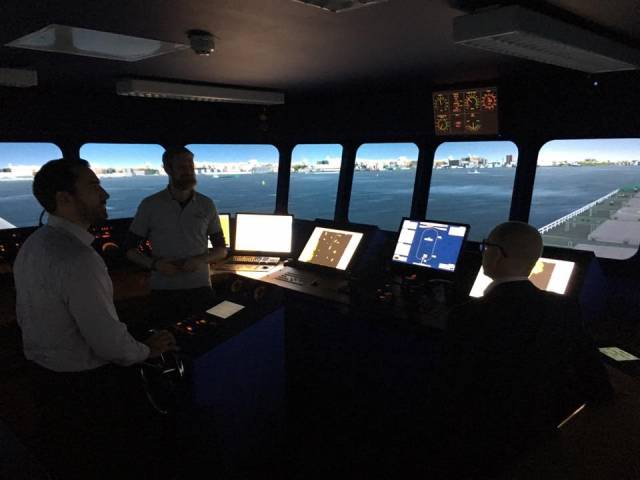 Capt. Conor Moynihan, demonstrating the NMCI's 360 full mission bridge simulator's capabilities