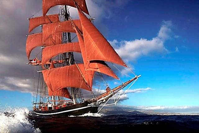Eye of the Wind with its distinctive reddish brown sails unfurled