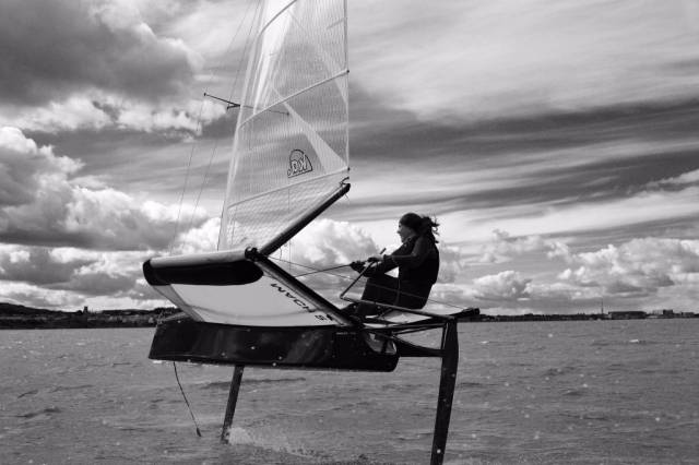 Annalise Murphy sailing a foiling Moth dinghy off Dun Laoghaire
