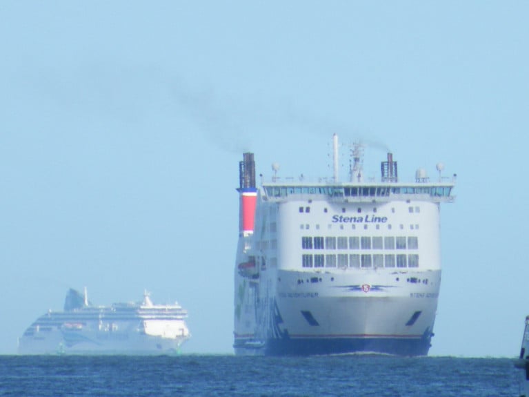 The 'Ferry Faces' of Stena Line's 'Seamaster' class Stena Adventurer arrives in Dublin Port ahead of Irish Ferries Ulysses when approaching in Dublin Bay. Both ferries compete on the core Irish Sea short-service route linking Holyhead, north Wales.