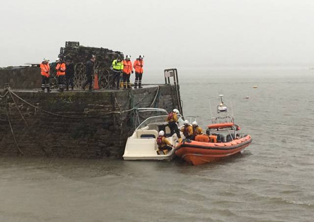 Youghal’s lifeboat volunteers tie the pleasure craft to the pier head in the harbour