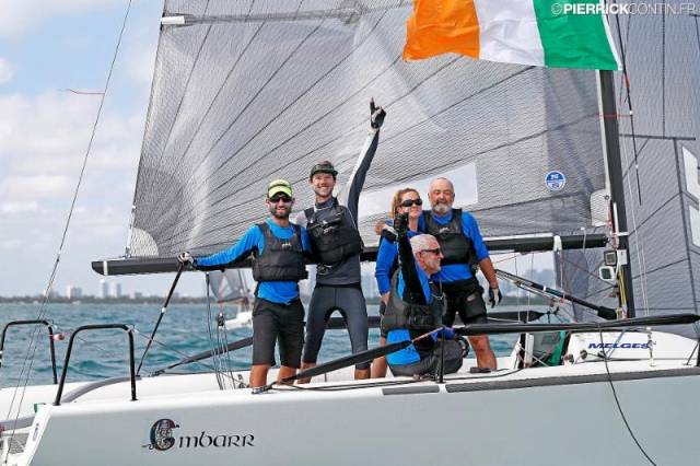They won by 31 points with a crew of all the talents. Conor  Clarke’s lineup aboard the all-conquering Embarr included (left to  right) American 470 Olympic sailors Stuart McNay and David  Hughes, while the home crew were Aoife English, Maurice “Prof”  O’Connell (seated), and Conor Clarke. Photo Pierrick Contin    A runaway victory of 31 points clear in a fleet of 72 boats in the  International Melges 24 World Championship in Florida made  Conor Clarke of Dun Laoghaire’s Royal Irish YC the Afloat.ie  “Sailor of the Month” for November.