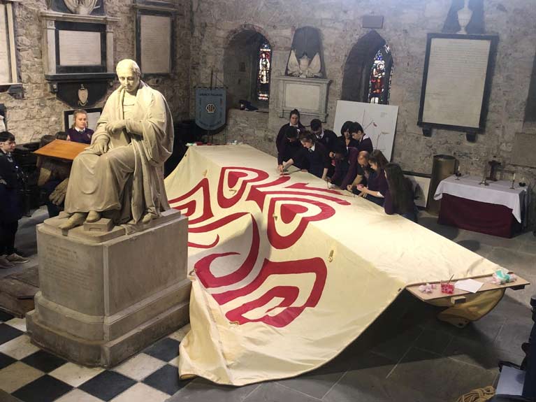 ILENS EDUCATIONAL SALMON SAIL BEING PAINTED BY SCHOOL CHILDREN IN ST.MARYS CATHEDRAL LIMERICK