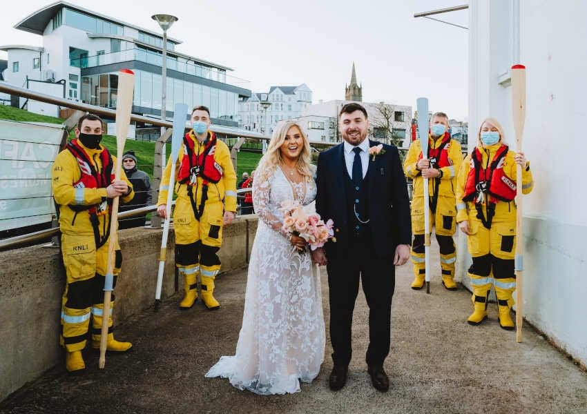 Jason Chambers and his wife Lauren received a special guard of honour from Portrush RNLI after their wedding last week (Photo: Mairéad McDaid/Remain In Light Photography)