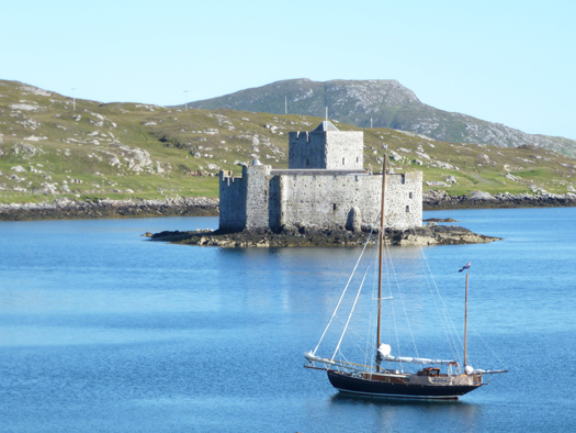 First port in the Outer Hebrides - Castlebay in Barra revelled in the August sunshine Photo: W M Nixon