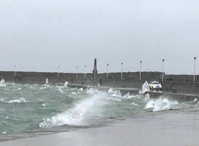 Optimist dinghies in a 45-knot gust end up on the East Pier wall observed by a Dun Laoghaire Harbour Police Patrol