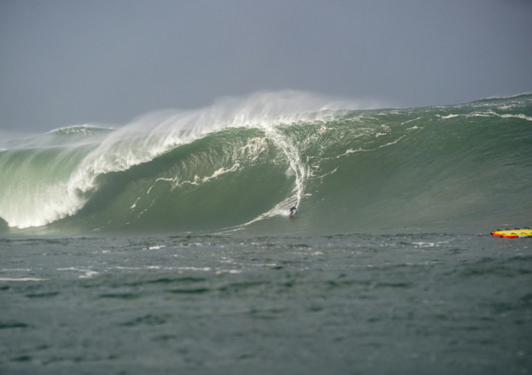 Conor Maguire surfs down a giant wave of Mullaghmore Head in the wake of Hurricane Epsilon