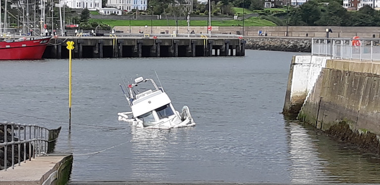 The sunken vessel across the Bangor Harbour slipway