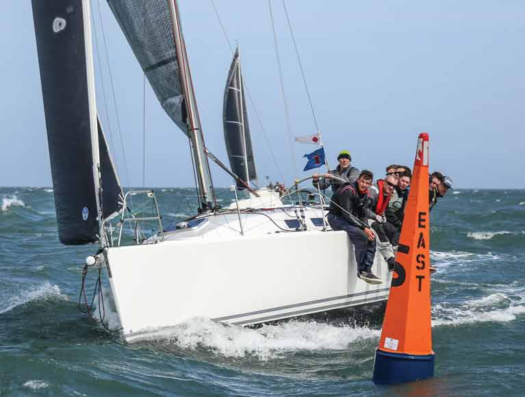 A J109 Class One yacht passes DBSC&#039;s East Mark in 2019. A club survey revealed large support for racing on the Bay this season