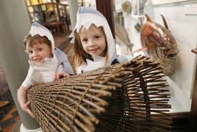 Rory Cahill (4) and Evelyn Cahill (6) from Dunboyne, Co Meath with a replica of a Mesolithic fish trap at the launch of Fishy Fun at the National Museum of Ireland - Natural History