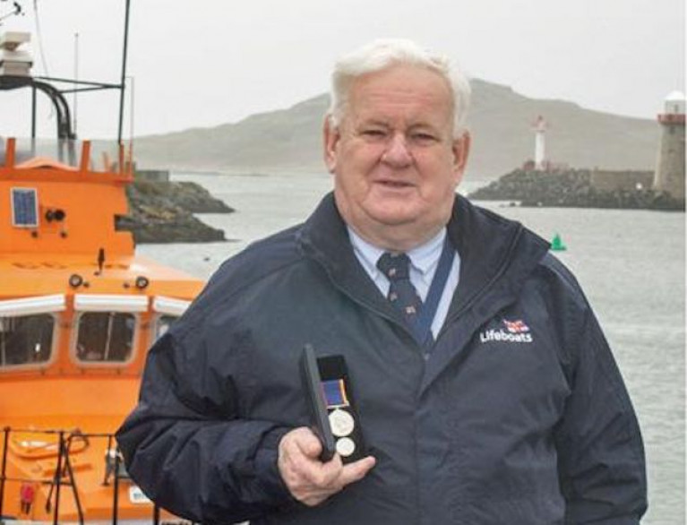 John McKenna with his RNLI long service medal