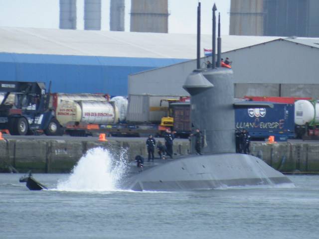 The distinctive "X" tail stern configuration of Dutch submarine HNLMS Walrus with wash generated when swinging off Ocean Pier in Alexandra Basin in Dublin Port. At this same pier is where currently a sister, HNLMS Zeeleeuw is docked alongside support ship HNLMS Mercuur. 