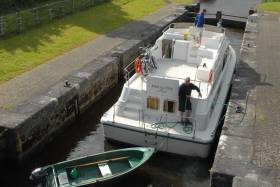A boat traverses a lock on the Shannon-Erne Waterway