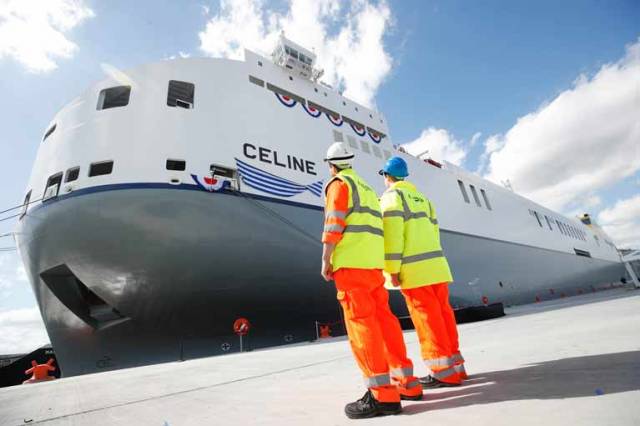  Port workers looking on to the MV Celine, the world’s largest short sea Ro-Ro ship owned by CLdN, christened at Dublin Port 