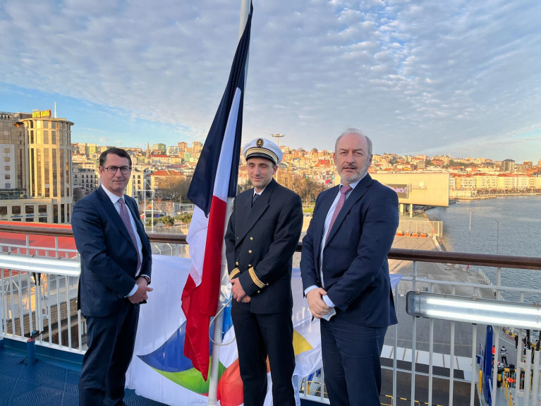 Reflagging ceremony on board Salamanca (and pictured) Jean Marc Roue, Cdt Christophe Bergeroux and Christophe Mathieu with the backdrop of the north Spanish port of Santander.  The E-Flexer class newbuild will serve UK-Spain routes. 