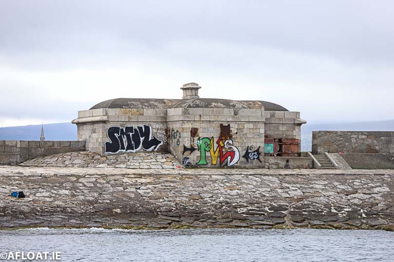 First sight of Dun Laoghaire from the sea: A shoreward view of vacant buildings are blighted by graffitii on Dun Laoghaire's West Pier. The council says graffiti poses a significant problem throughout the Dun Laoghaire area