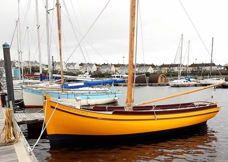 Local products….the 25ft Shannon Hooker Sally O&#039;Keeffe (left) was community-built in 2015 in Querrin on the Loop Head Peninsula near Kilrush under the guidance of Steve Morris, while the new 24ft Galway Bay Gleoiteog Naomh Fanchea has been built in Steve&#039;s busy boatyard in Kilrush itself. 