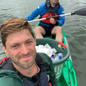 Danish GreenKayak joins Dublin’s City Kayaking to offer free trips to pick up plastic. Above: Tobias Weber-Anderson of GreenKayak on the Liffey with bucket full of litter. 