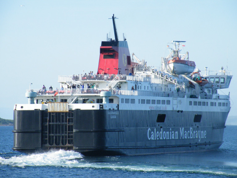 Ferry passengers in Scotland were forced to take a bus on an over 150 mile journey as one of CalMac's oldest vessels had to be redeployed. Above, the ferry involved, Caledonian Isles is as Afloat adds underway off Brodick, Arran during a previous summer sailing when bound for Ardrossan on the Firth of Clyde. 