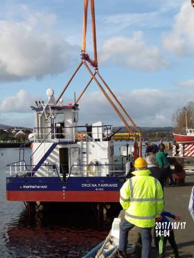 Newbuild Croi na Farraige, a 17.5m salmon farm harvesting vessel is lowered into the River Avoca in Arklow