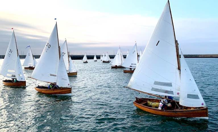 With all of Dun Laoghaire Harbour to play with, and an unusual evening onshore breeze, the Water Wag fleet takes all the tactical options on Wednesday evening. Polly (31, Roger Mossop & Henry Rooke), Badger (20, John & Anne Marie Cox) and Ethna (1, David Sommervillle & Pauline McNamara) in foreground