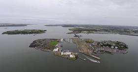 Haulbowline Island where the site of the public park that is to open is located at the East Tip (left side) noting this file photo Afloat adds shows waste deposits mounds from the former Irish Steel Plant. 