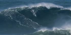 Tom Butler surfing the giant wave off Nazaré on Friday 14 December