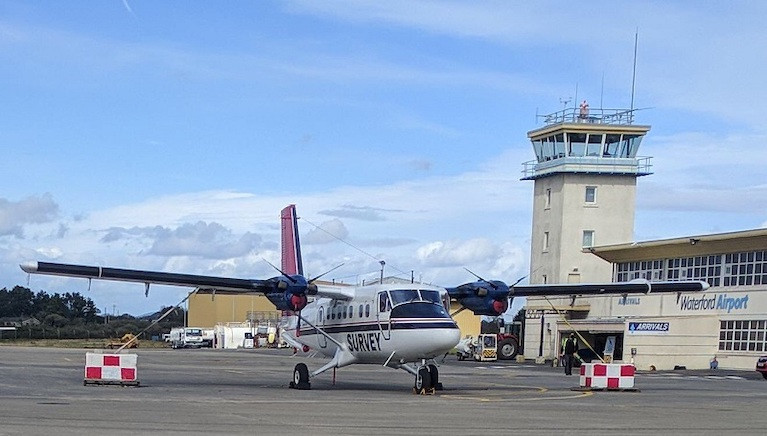 The survey aircraft is a white, twin-propeller plane (as pictured), which is easily identified by its red tail and black stripe as well as the word ‘SURVEY’ 