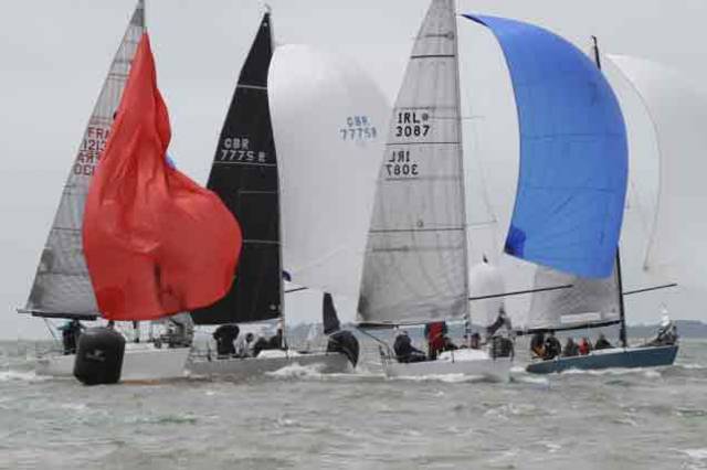 IRL 3087 Anchor Challenge (Paul Gibbons) at a busy mark rounding at the Quarter Ton Cup in Cowes