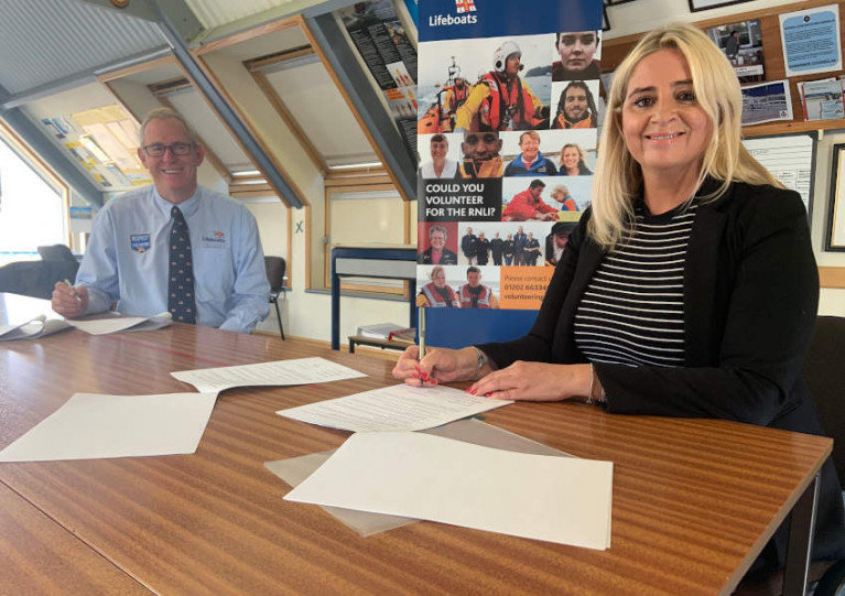 John Payne, director of lifesaving operations for the RNLI, and HM Coastguard director Claire Hughes sign the MOU at Dover Lifeboat Station on Thursday 1 October