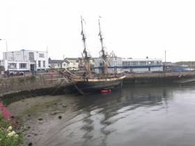 Almost tucked into the corner of the Old Harbour, the innermost within Dun Laoghaire Harbour was the tallship Phoenix that called in briefly for repairs to the brig&#039;s bottom timbers. The sight of such a vessel at this location was a surprise no doubt to onlookers and DART commuters alike. 