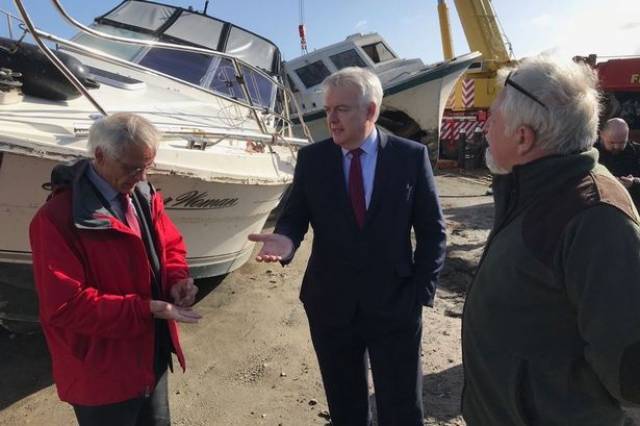 The Welsh First Minister Carwyn Jones on a visit this week to Holyhead Marina on Anglesey. The Welsh Government is to fund £100,000 to help businesses and promote tourism after havoc wreaked by Storm Emma took place in March. 