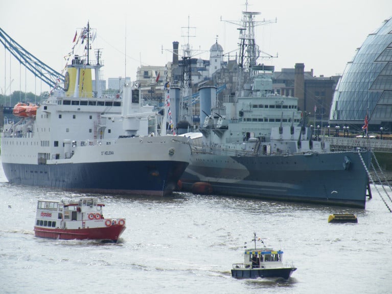 HMS Belfast berthed in the Pool of London, named the National Historical Ships UK Flagship of 2020, for showing, along with its fellow regional flagships, "tenacity in continuing to raise their profile throughout the Covid-19 outbreak". In this file photo is also former St. Helena serving passenger cargoship RMS St. Helena during its historic farewell and only visit to the UK capital in 2016, before disposed following opening of an airport on the remote UK territory deep in the South Atlantic Ocean. During the mid 1990's RMS St. Helena notably visited Dublin and Cork during a cruise-charter. Afloat will have an update on this ship's sporting role!