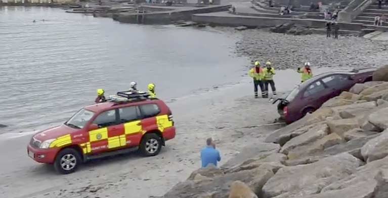 The Nissan Almera reversed over the pavement at Salthill promenade and fell about six metres (20 ft) down towards the beach.