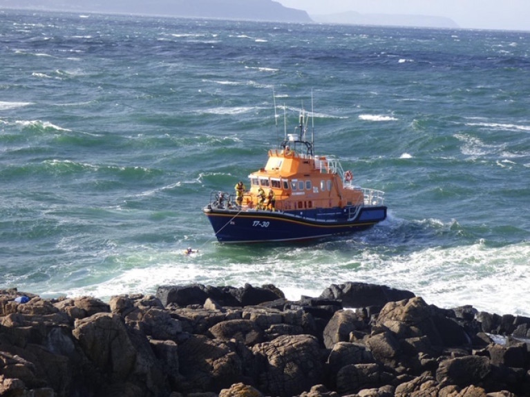 Portrush RNLI Lifeboat approaches the teenager