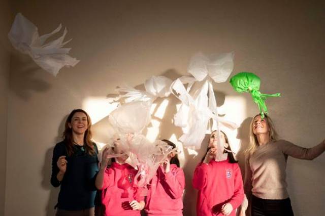 Aoife Deane UCC and Sara Mackeown Port of Cork with Caomihe Mc Sweeney, Emily Rose and Caoimhe Ni Bheara of Scoil Bhríde Crosshaven Co Cork pictured with their 'Bloom of Plastic Jelly Fish'