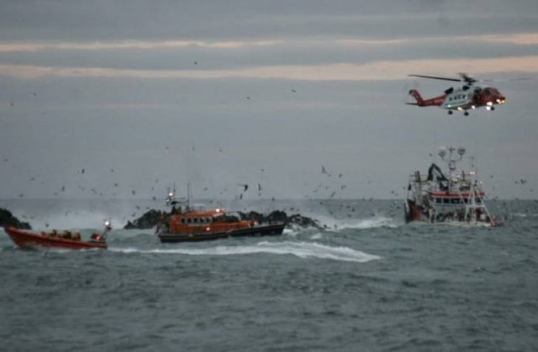 Portaferry and Newcastle RNLI working with Rescue 116 to rescue the crew of the grounded fishing boat in October 2019
