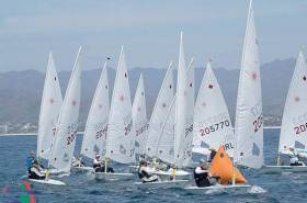 Howth&#039;s Aoife Hopkins (205770) arrives into the weather mark on port tack in race three of the Laser Worlds in Mexico, neck and neck with Dutch star Marit Boumeeester in 206333