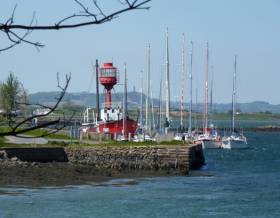 The distinctive Down Cruising Club headquarters in the 102-year-old former lightship Petrel at Ballydorn in Strangford Lough, with the famous Scrabo Tower in the distance beyond. But is Scrabo as high as officially stated?