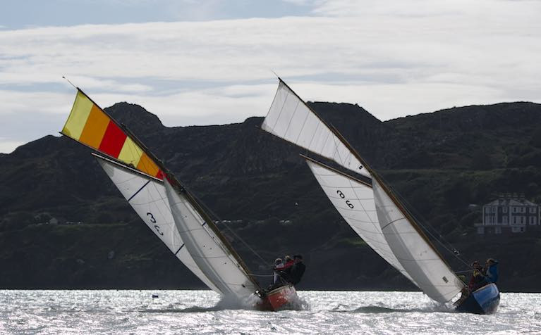 A fair tide with a soldier's wind for Lambay – Roddy Cooper's Leila (built Carrickfergus 1898) and Anita (D.O'Connell & M. Karasahin, built Kingstown 1900 and re-built France 2019) at the start of the Howth 17's Lambay Race