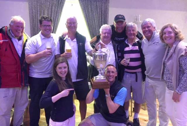  Act 2 Owners Michael O’Leary, David Andrews and Tom Roche all of the Royal Irish Yacht Club with their crew and supporters celebrate in Schull on their Calves Week win in the Fastnet Race