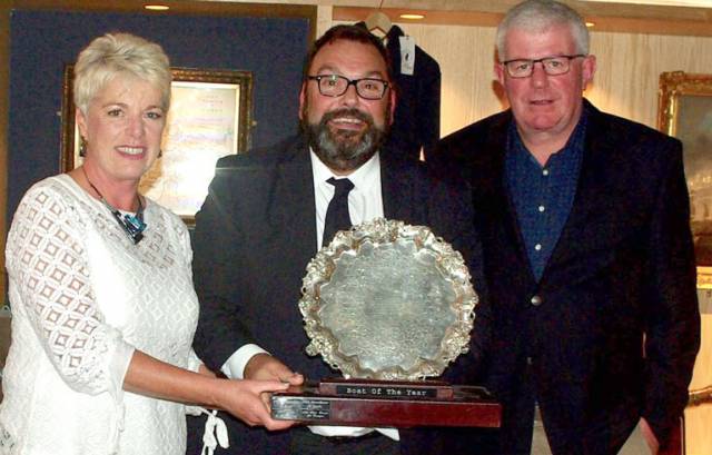 Denis Murphy (right) and Ann Marie Murphy of Nieulargo are presented with the RCYC Boat of the Year award by RCYC Vice Admiral Colin Morehead