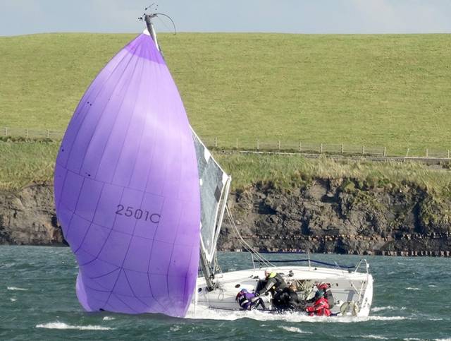 A competitor broaches in a breezy outing on the Shannon Estuary yesterday. Scroll down for more photos below
