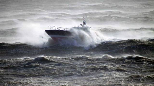 Rising Sea Levels: A pilot cutter in rough seas off the Irish coast which have risen 7cms alone since early 1990's. The next 5-15 years are critical to act if we are to stop 'permanent' damage to the planet