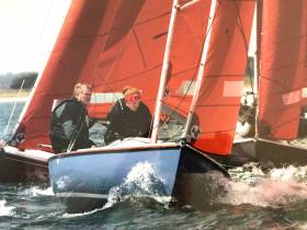 The serious helmsman. Jack Roy and his daughter Jill racing their Squib class Kanaloa, no 130. One of the oldest boats racing in the Dublin Bay class, they worked together to restore her from a near-derelict condition