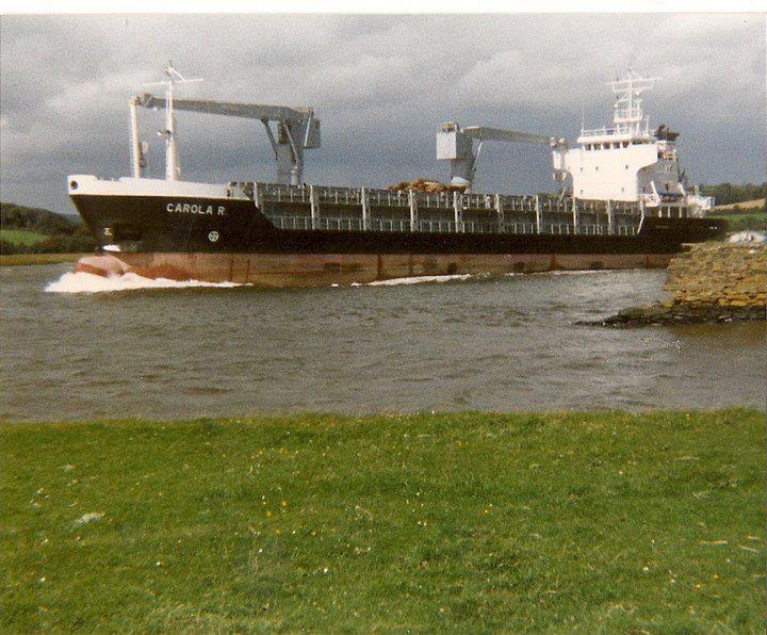 Winds of change are blowing at New Ross Port, Co. Wexford, which is in profit but has major legacy issues. The above (1980's) scene, Afloat adds is of general cargoship, MV Carolina R when outbound at White Church along the banks of the River Barrow.
