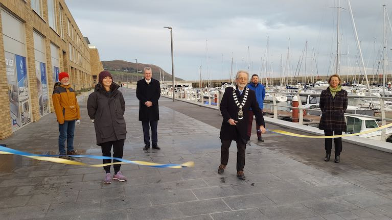 Cllr Derek Mitchell cuts the ribbon on the new coastal park and boardwalk overlooking Greystones Marina in County Wicklow. Front row left to right: Pamela Lee, Derek Mitchell, Breege Kilkenny (Director of Planning WCC),  Back Row. Norman Lee, Frank Curran (Chief Executive WCC), Merlin Ovington (WCC)